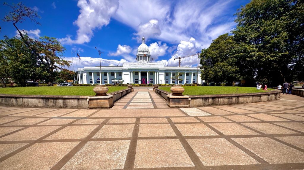 Neoclassical Municipal Council Building in Colombo with grand dome and tall Corinthian columns, situated overlooking Viharamahadevi Park.