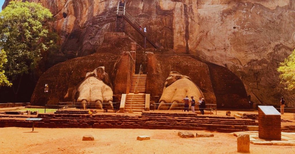 Stone-carved lion paws at Sigiriya Fortress entrance, remnants of a giant lion sculpture guarding the stairway.